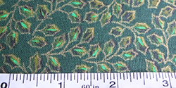 Cotton Christmas fabric - holly leaves on green background