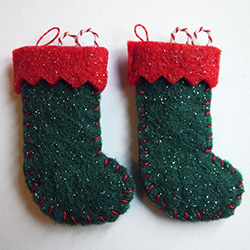A pair of green and red felt Christmas stockings 