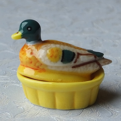 Two-part lidded porcelain casserole dish shaped as a duck