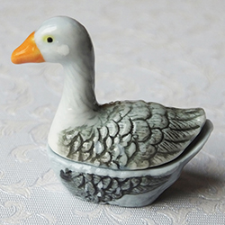 Two-part lidded porcelain casserole dish shaped as a goose