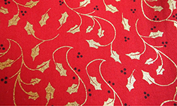 Christmas cotton, gold holly on red background