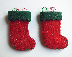 A pair of red and green felt Christmas stockings 