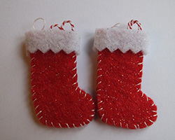 A pair of red and white felt Christmas stockings