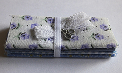 Fabric bundle with lace and scissors